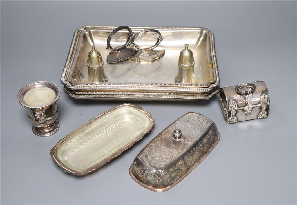 A pair of silver plated entree dishes with covers and handles, a plated butter dish, two condiments, a small vase and a trinket box